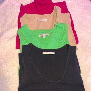 Four sweater vests